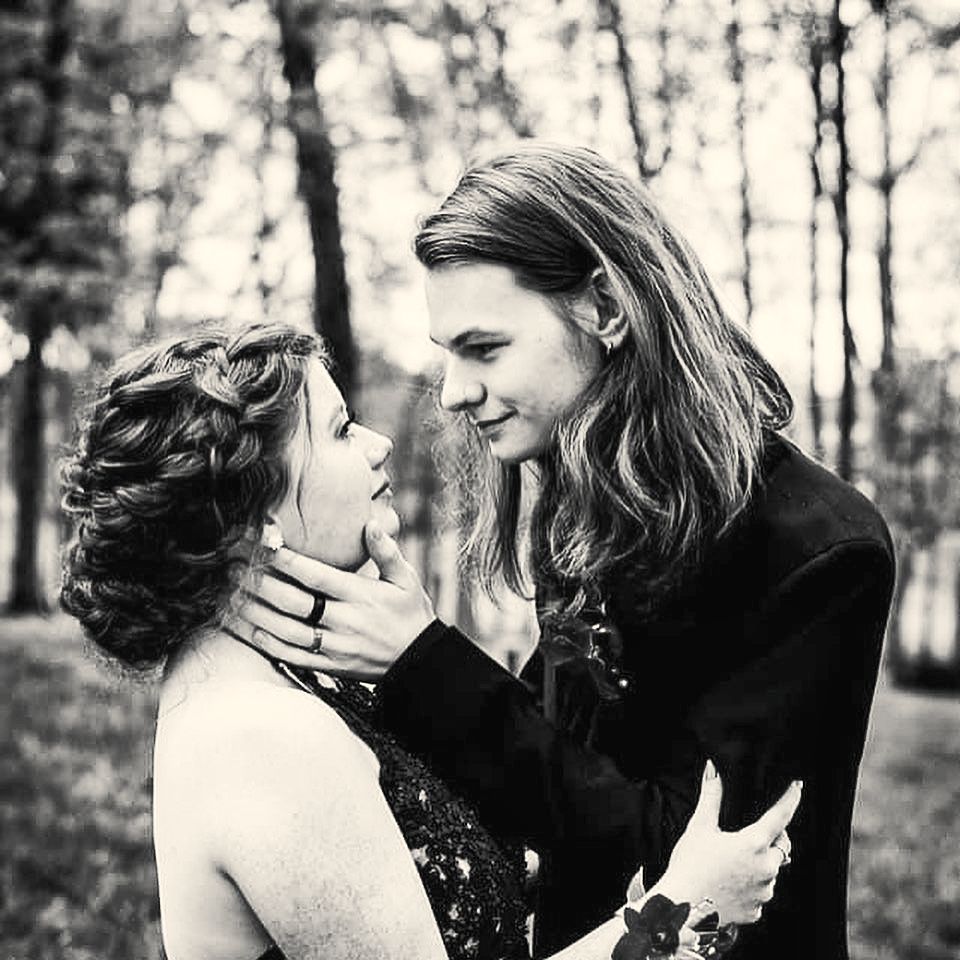 Prom couple with romantic curled style